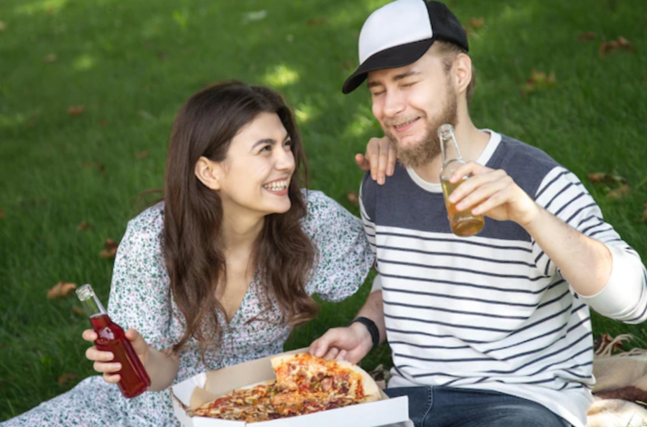 A young man and woman on a picnic on a date together