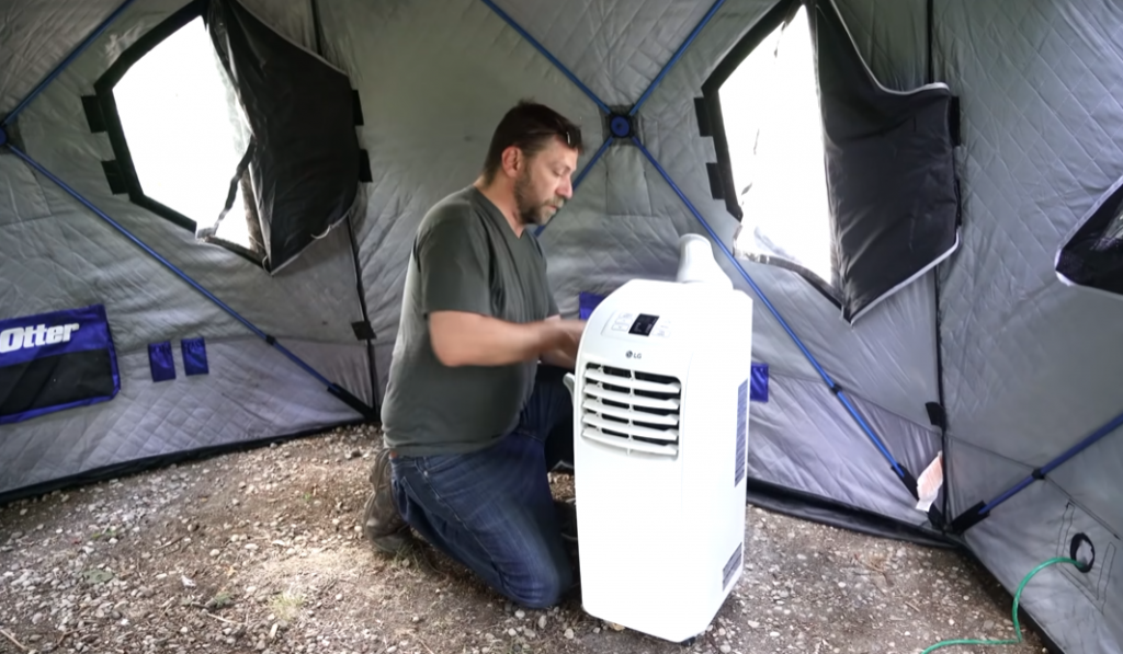 men in tent installing ac