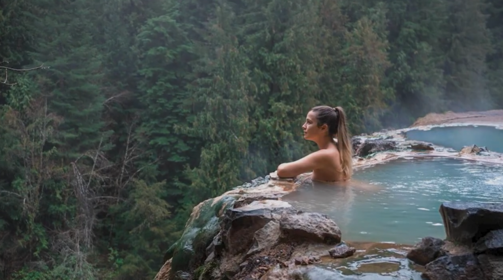 Woman immersed in hot springs